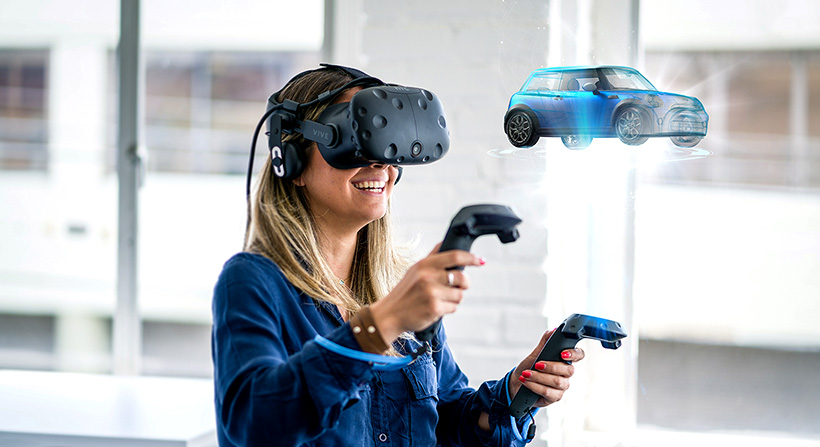 Young female wearing VR headset and visualizing a blue car