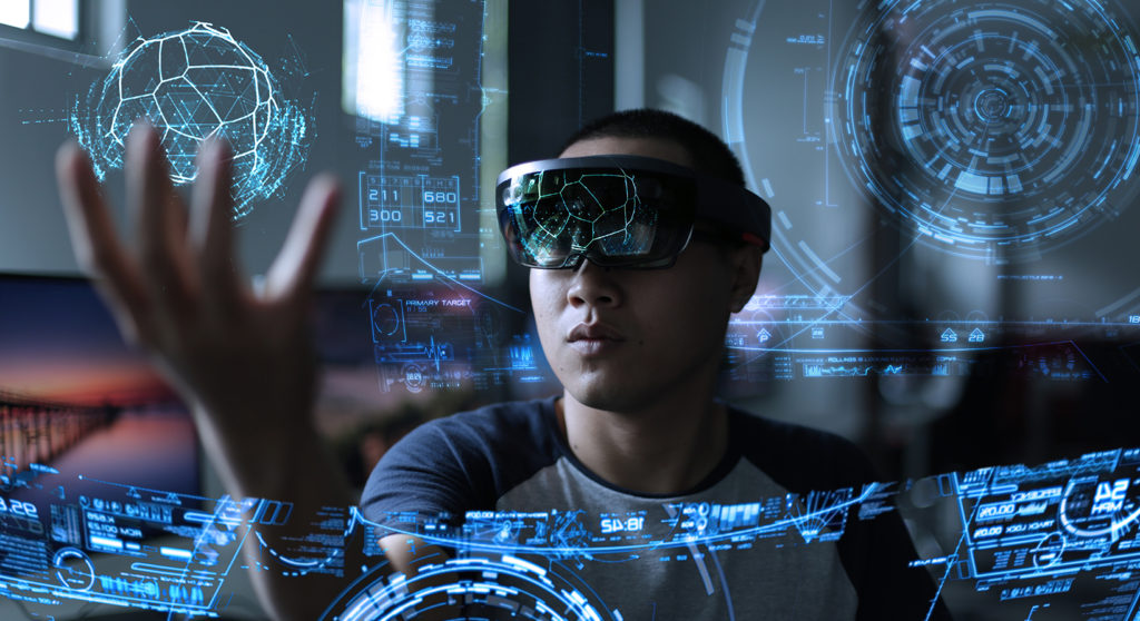 man wearing hololens and playing with a holographic object