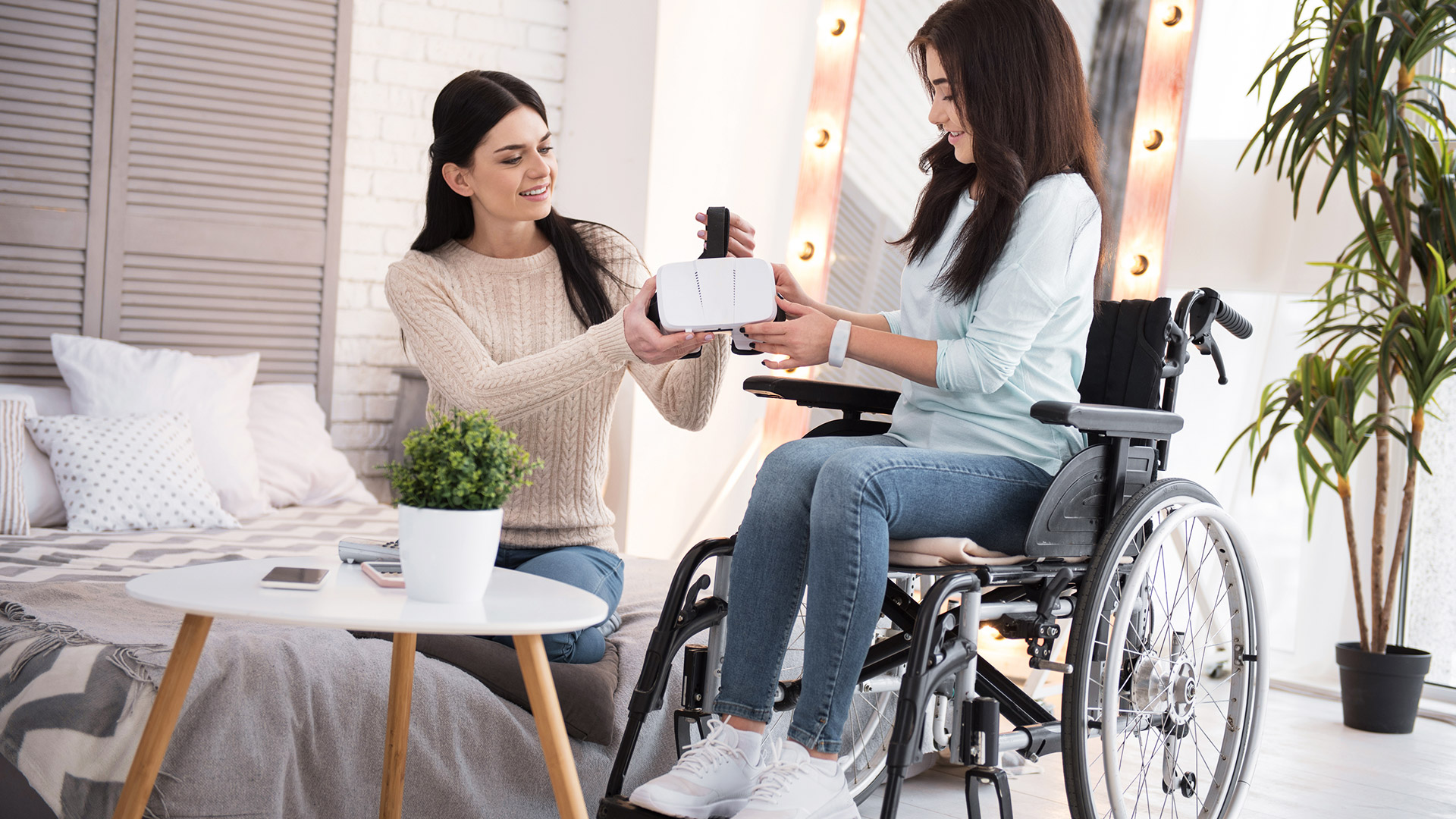 Female patient trying virtual reality in a wheelchair