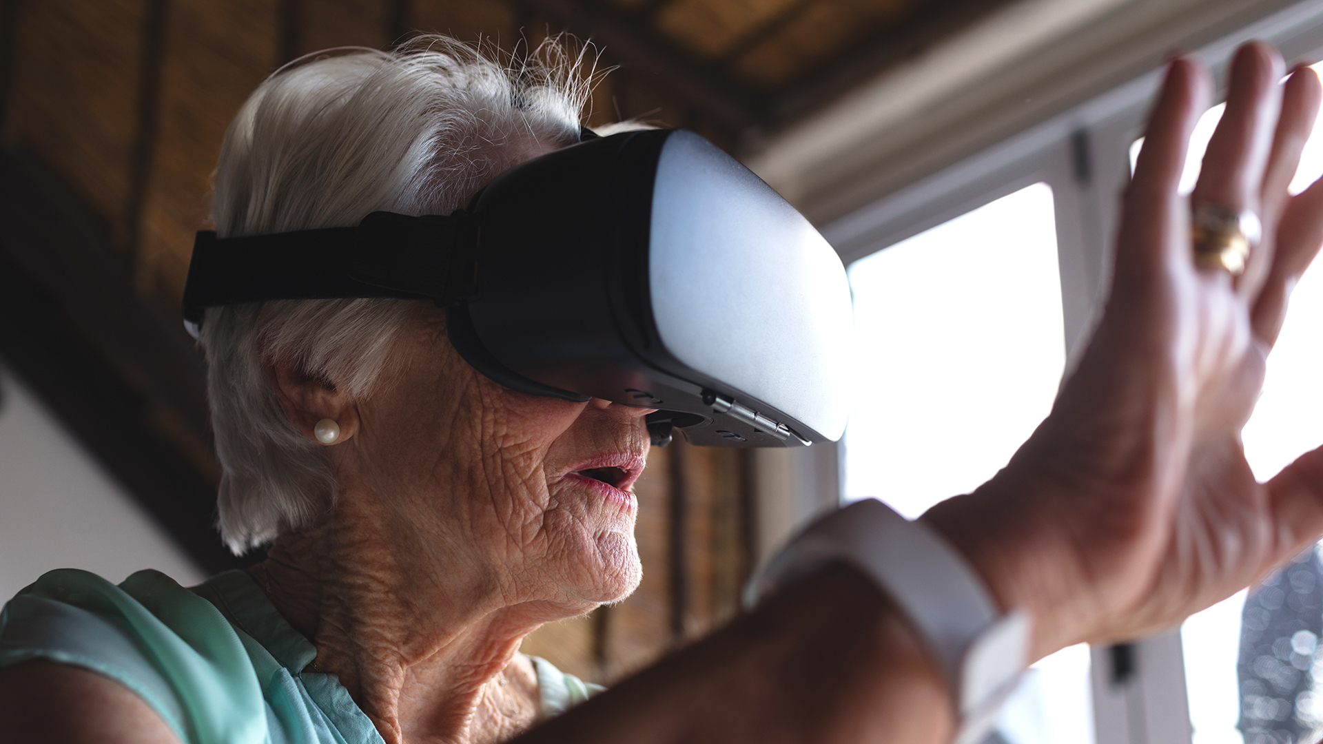 Senior woman using virtual reality headset